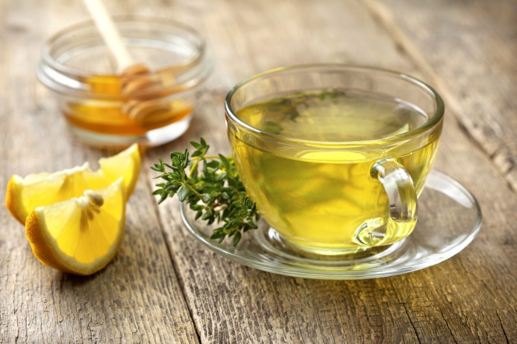 thyme tea in glass cup